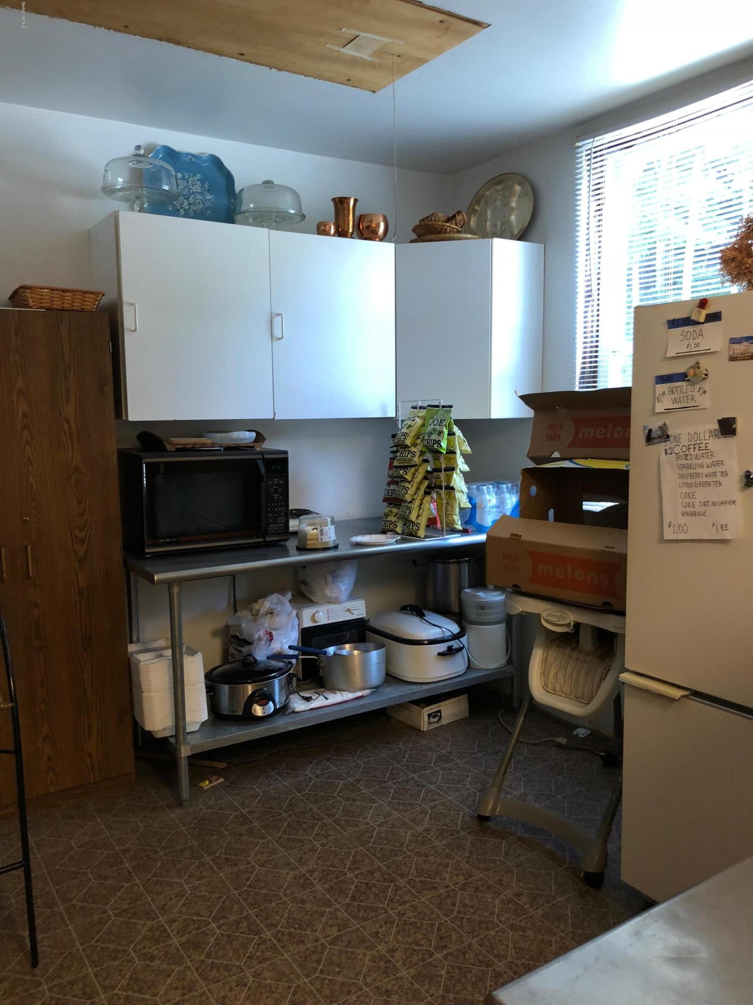 160 High Street Lee, MA 01238 - Photo 9 of 16 a kitchen with stainless steel appliances kitchen island granite countertop a stove and a refrigerator