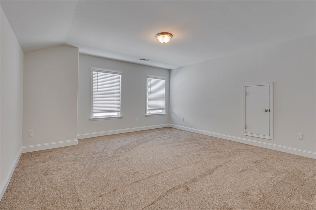 141 Capslock Trail Pendleton, SC 29670 - Photo 35 of 38 Well-lit room featuring ample natural light and plush carpeting for ultimate comfort.