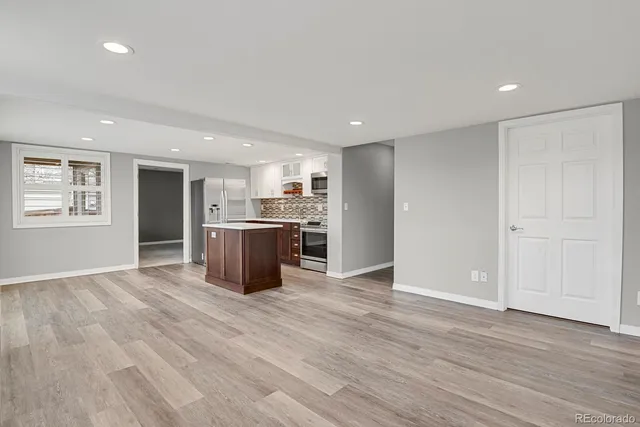 a view of kitchen with wooden floor