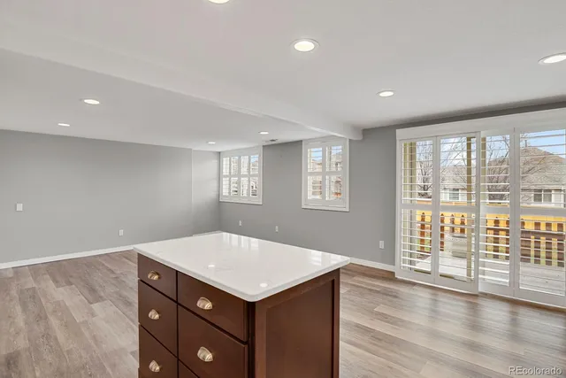 a view of kitchen with a sink and wooden floor