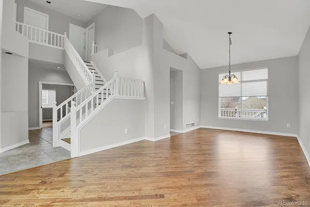 a view of an entryway with wooden floor