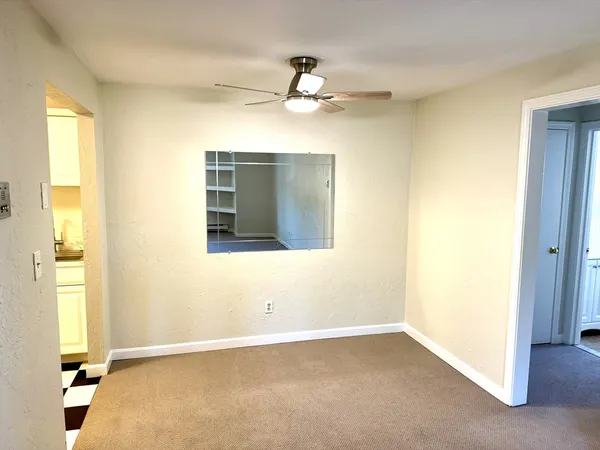 a view of an empty room and window