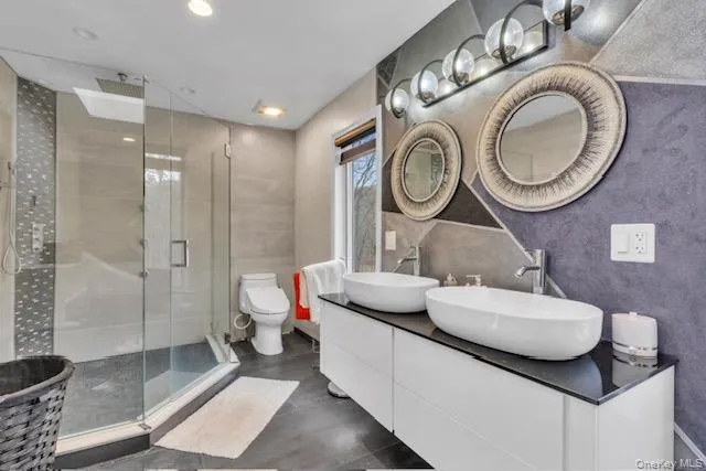 a living room with a couch and cabinets