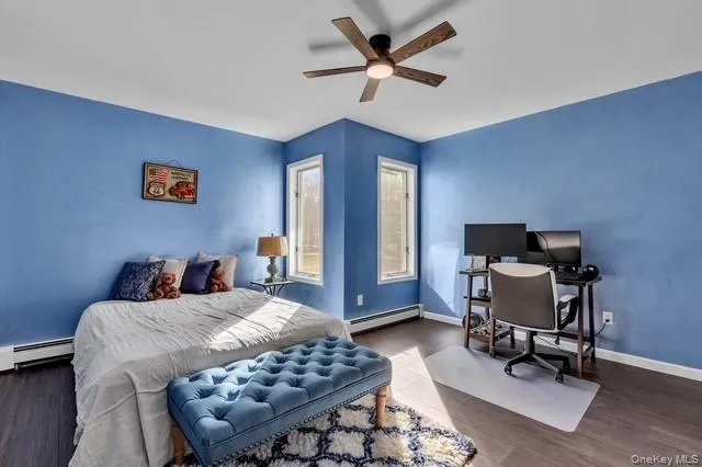 a bathroom with a granite countertop double vanity and a mirror