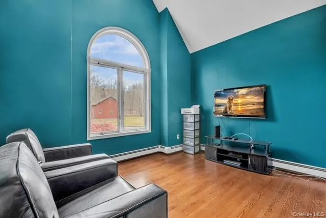 a bedroom with furniture and a window