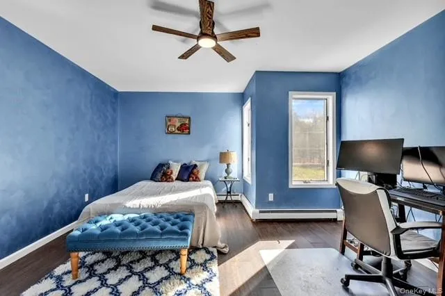 a bathroom with a bathtub shower sink and toilet
