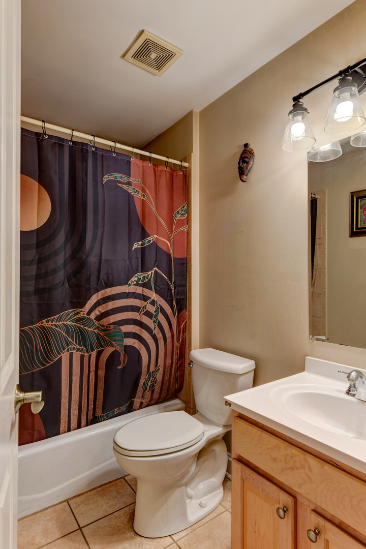 4999 Hawk Lane Monee, IL 60449 - Photo 15 of 20 a bathroom with a sink a toilet a mirror and shower