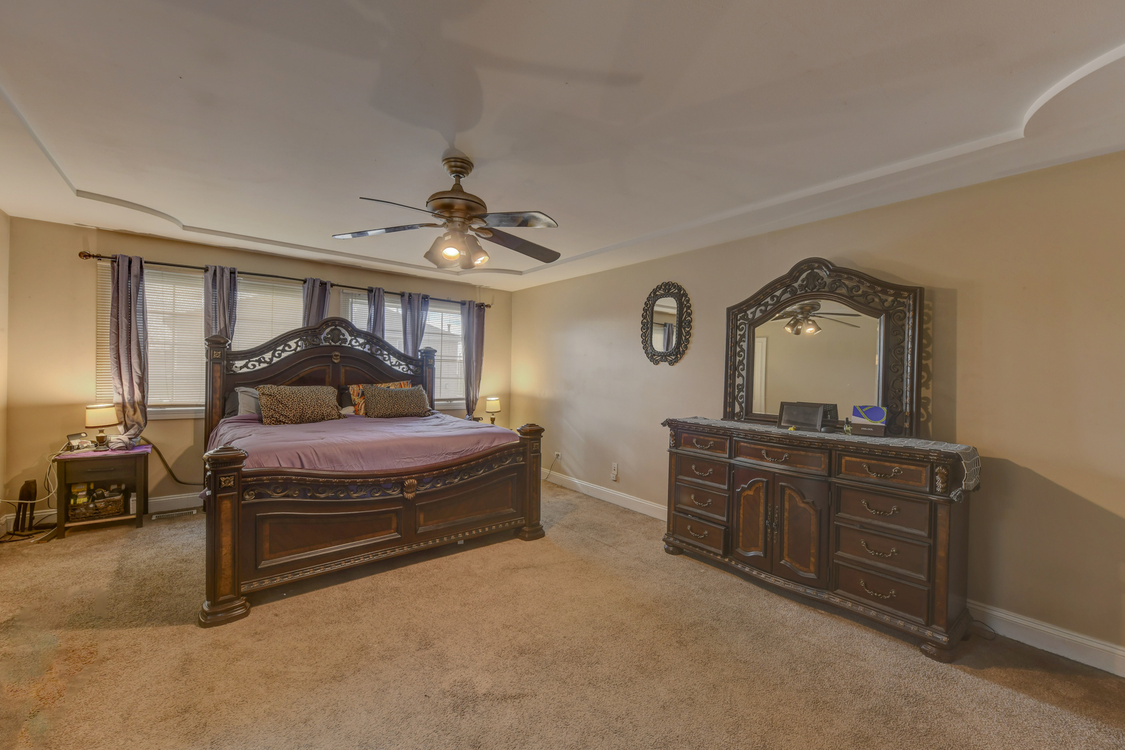 4999 Hawk Lane Monee, IL 60449 - Photo 10 of 20 a bedroom with a bed and dresser with mirror