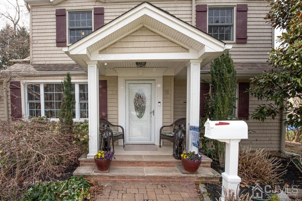18 Richard Road East Brunswick, NJ 08816 - Photo 1 of 40 a front view of a house with a fountain and a fountain