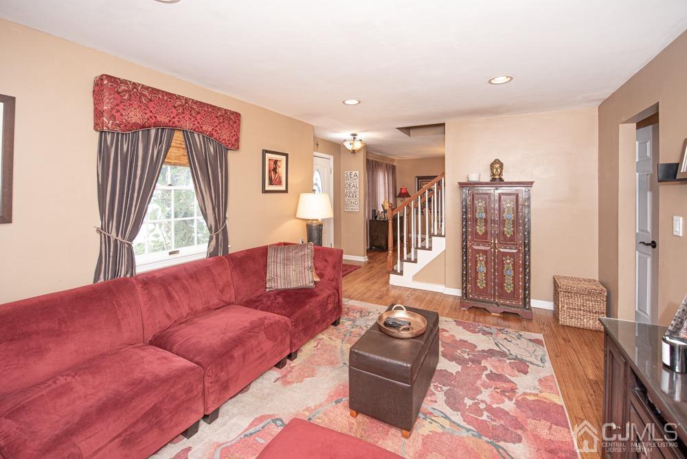 18 Richard Road East Brunswick, NJ 08816 - Photo 15 of 40 a living room with furniture and a flat screen tv