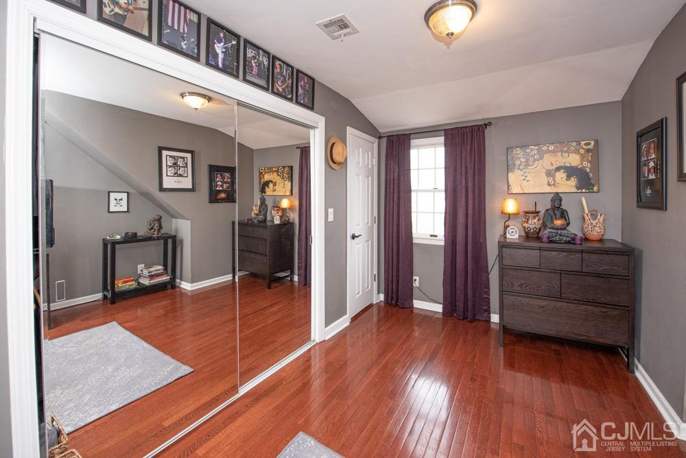 18 Richard Road East Brunswick, NJ 08816 - Photo 32 of 40 a room with wooden floor and furniture