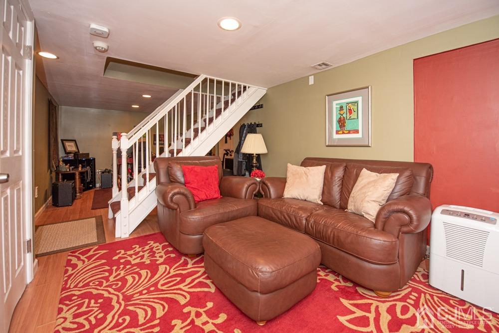 18 Richard Road East Brunswick, NJ 08816 - Photo 37 of 40 a living room with furniture and a rug