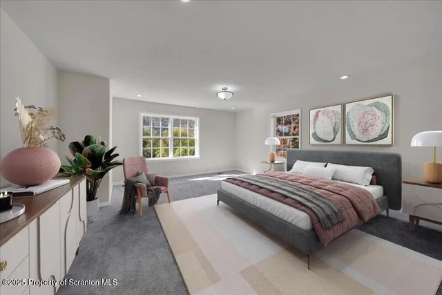 a spacious bedroom with a bed and painting on the wall