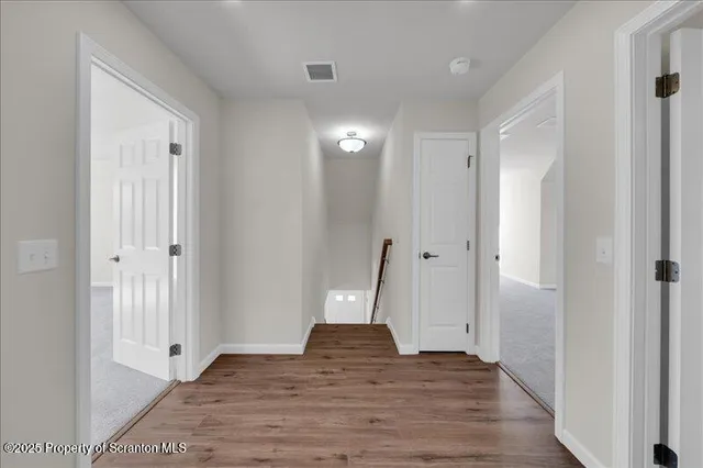 a view of a livingroom with wooden floor