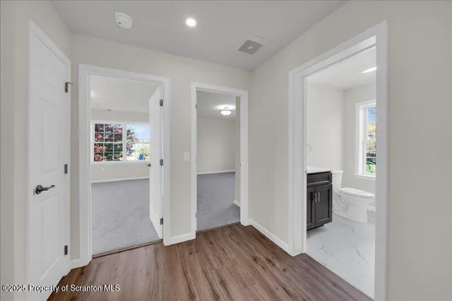 wooden floor in an empty room and a window