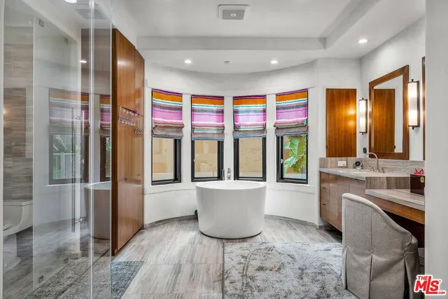 a bathroom with a sink and mirror