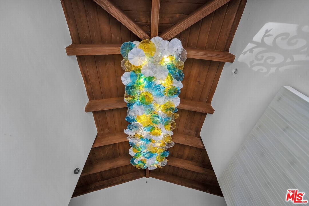 3110 Benedict Canyon Drive Beverly Hills, CA 90210 - Photo 3 of 70 a vase of flowers sitting on a floor