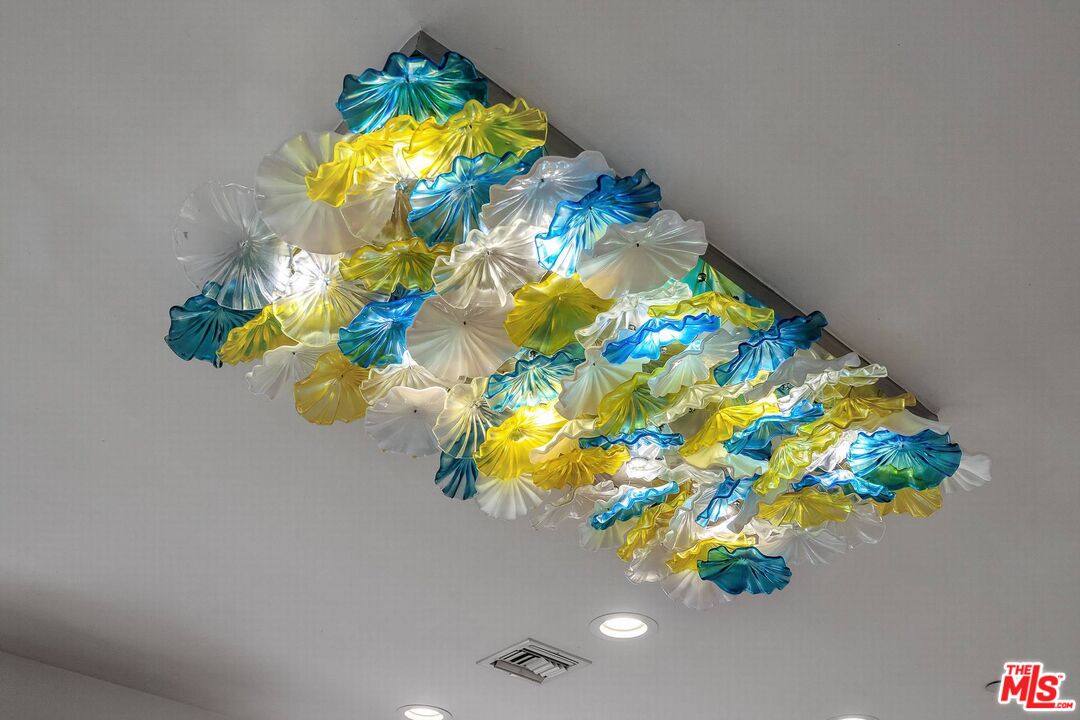 3110 Benedict Canyon Drive Beverly Hills, CA 90210 - Photo 38 of 70 a bathroom with a sink and mirror