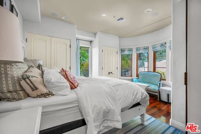 a bed room with a bed and a dresser