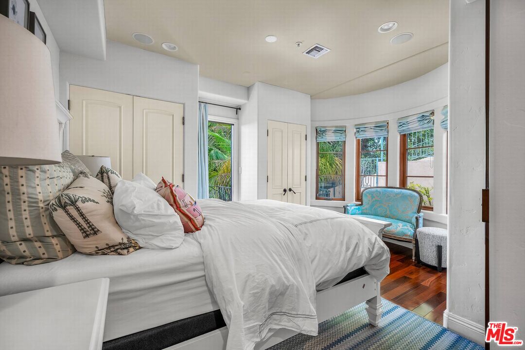 3110 Benedict Canyon Drive Beverly Hills, CA 90210 - Photo 40 of 70 a bedroom with a bed and a window