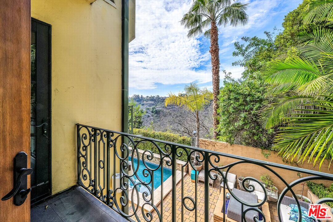 3110 Benedict Canyon Drive Beverly Hills, CA 90210 - Photo 42 of 70 a city view from a balcony with wooden floor