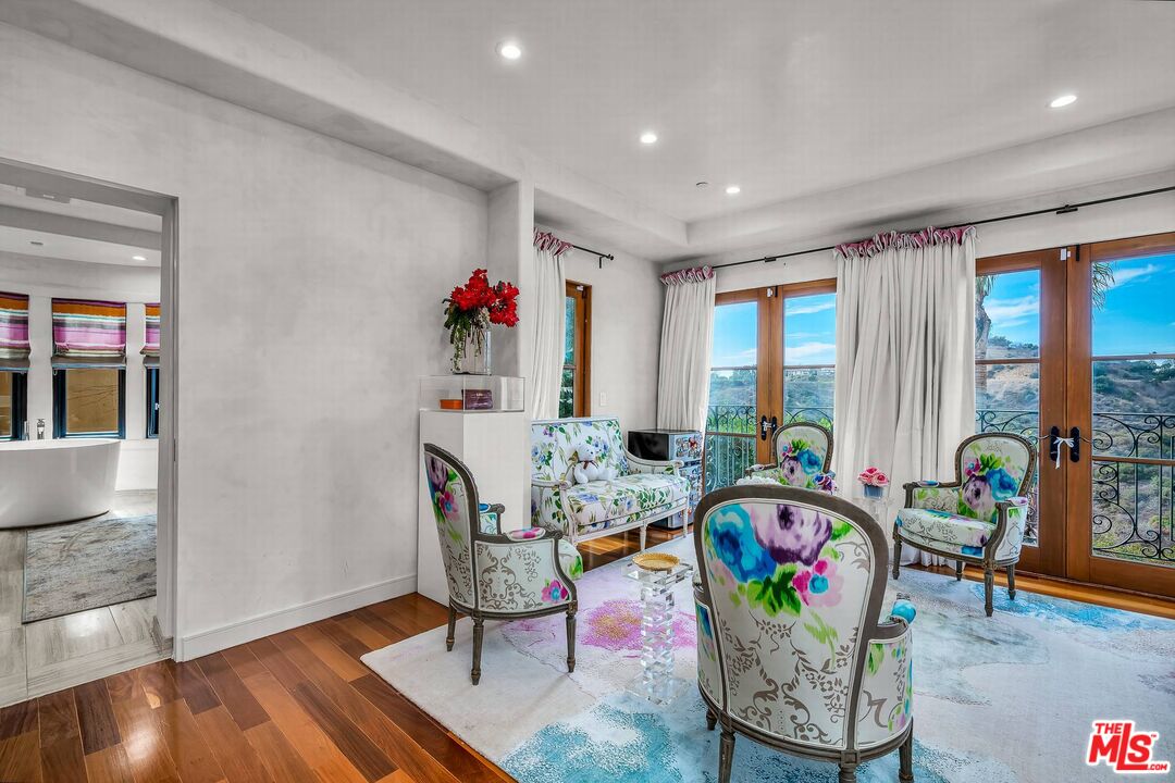 3110 Benedict Canyon Drive Beverly Hills, CA 90210 - Photo 48 of 70 a living room with furniture and a potted plant