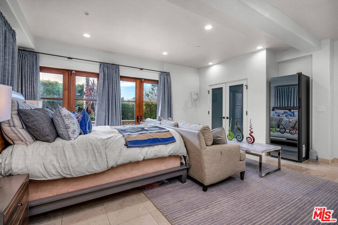 3110 Benedict Canyon Drive Beverly Hills, CA 90210 - Photo 52 of 70 a living room with furniture and a large window