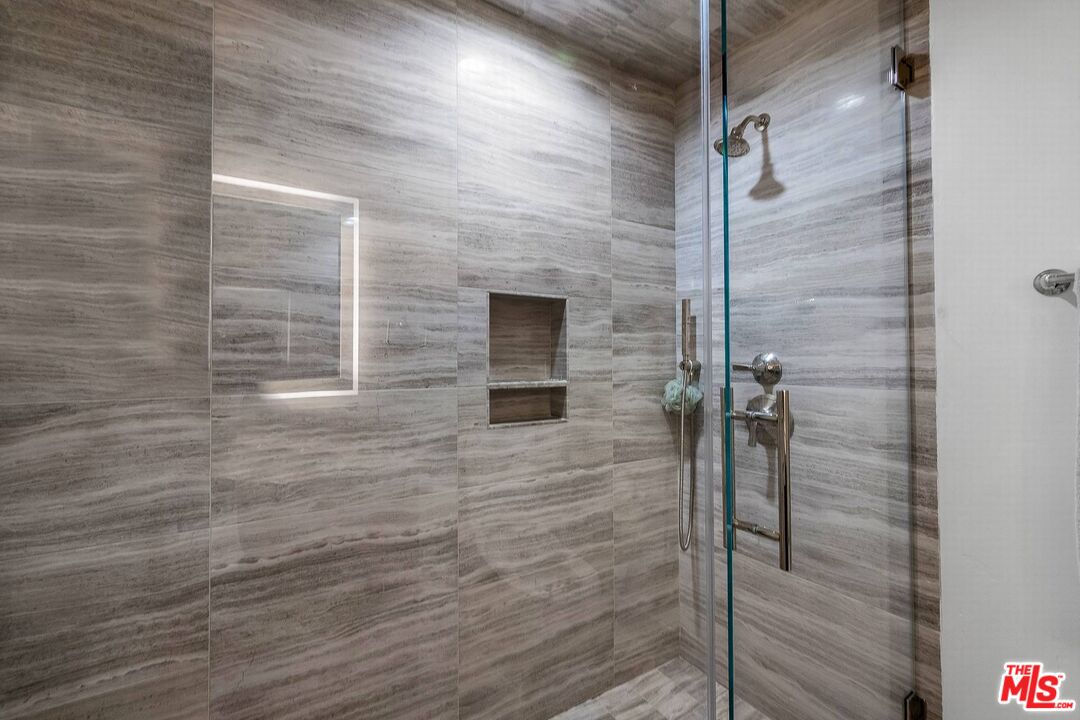 3110 Benedict Canyon Drive Beverly Hills, CA 90210 - Photo 53 of 70 a bathroom with a shower