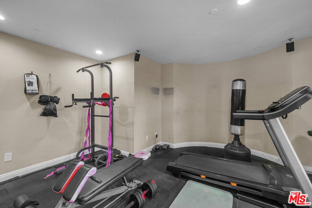 3110 Benedict Canyon Drive Beverly Hills, CA 90210 - Photo 62 of 70 a room with gym equipment