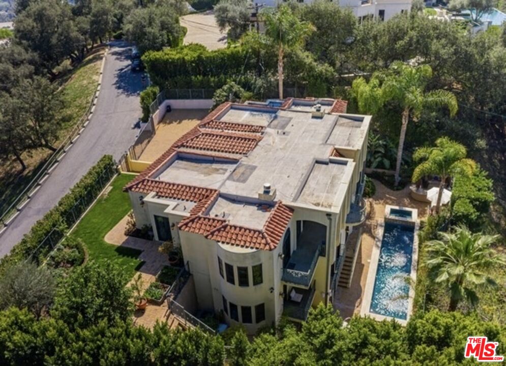 3110 Benedict Canyon Drive Beverly Hills, CA 90210 - Photo 64 of 70 an aerial view of a house with a yard and furniture