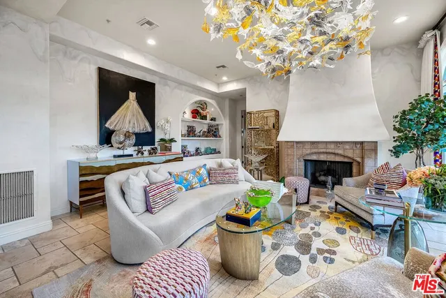 a view of a dining table and chairs in a patio