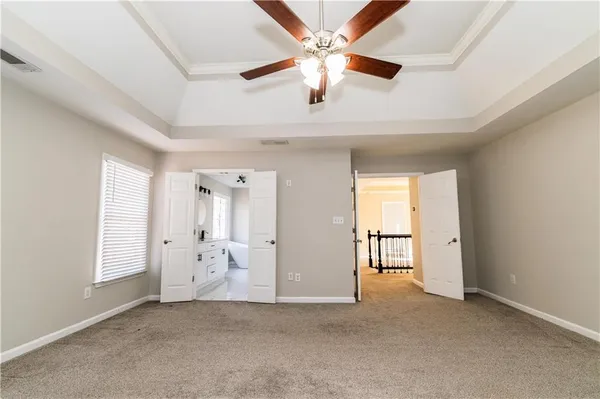 a bathroom with a tub and shower