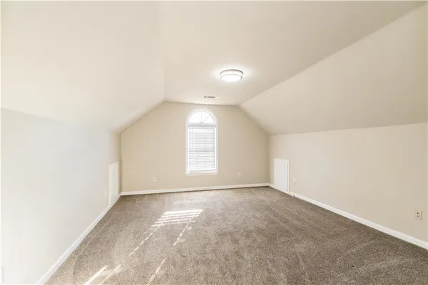 a view of an empty room with windows