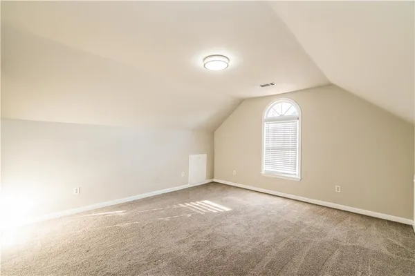 a view of staircase with rug floor