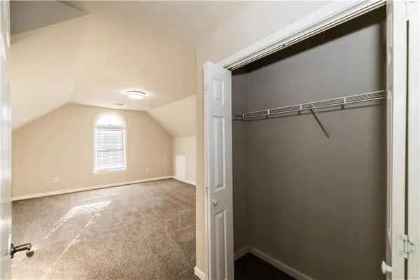 a bathroom with a double vanity sink toilet and a mirror