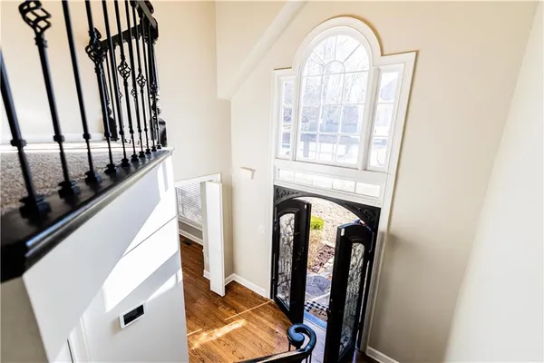 a kitchen with stainless steel appliances granite countertop a sink a refrigerator and a stove