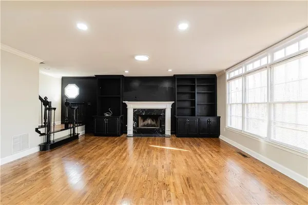 a view of empty room with a fireplace