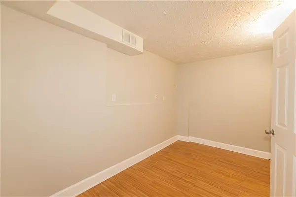 a view of a balcony with trees