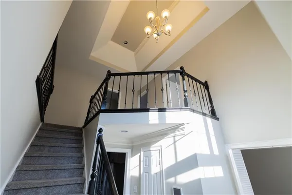 a view of a hallway with a chandelier