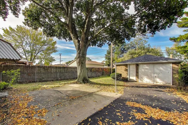 a view of a backyard of the house