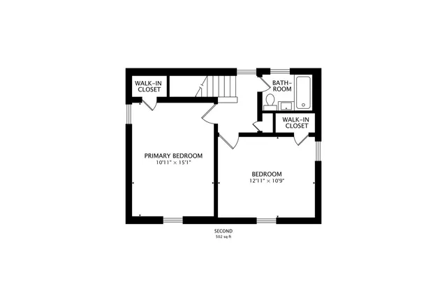 a picture of a bench in front of a wall