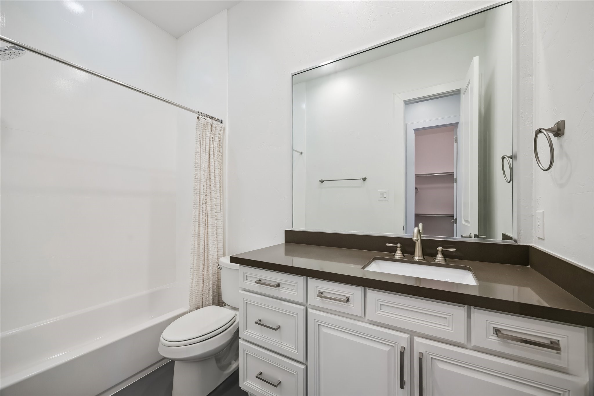 1208 Welch Street Houston, TX 77006 - Photo 22 of 35 The clean modern lines of the en-suite bathroom make this room ideal for your decorating touches.