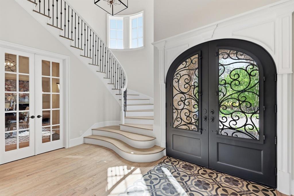 476 Hidden Valley Lane Coppell, TX 75019 - Photo 2 of 40 a view of entryway with stairs and wooden floor