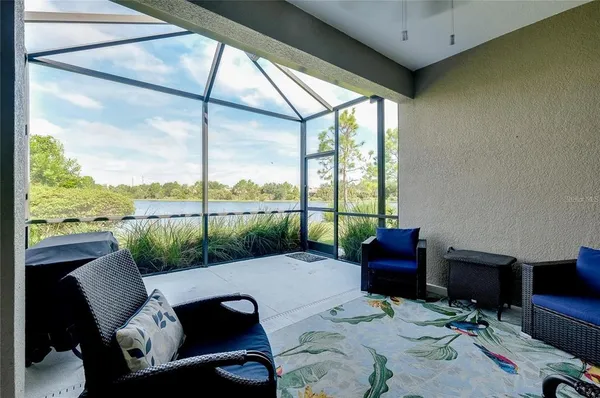 a balcony with furniture and a garden