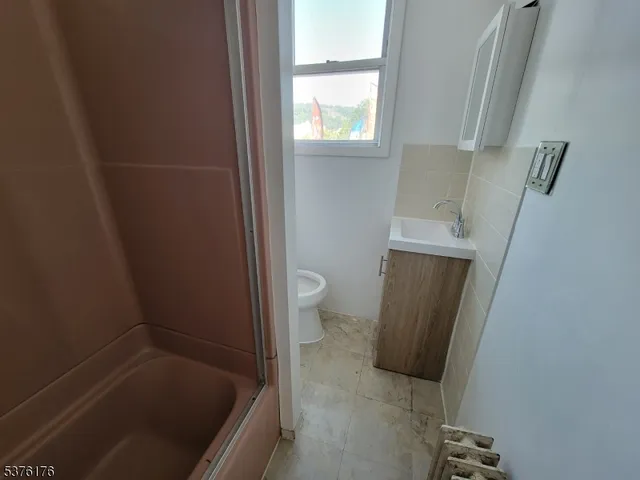 a bathroom with a sink and toilet