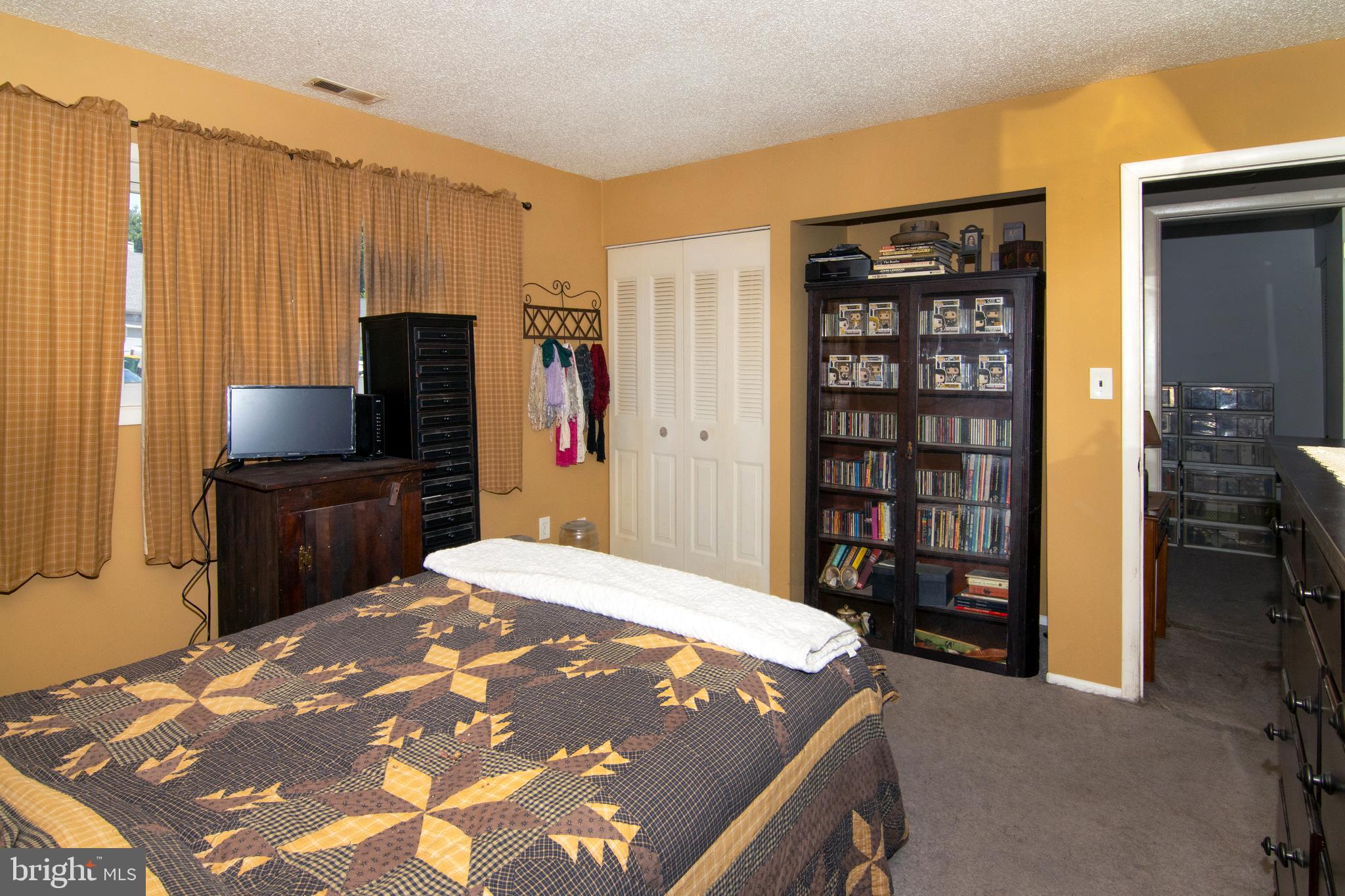 15 Dover Drive Lindenwold, NJ 08021 - Photo 19 of 24 a bedroom with a large bed and a book shelf
