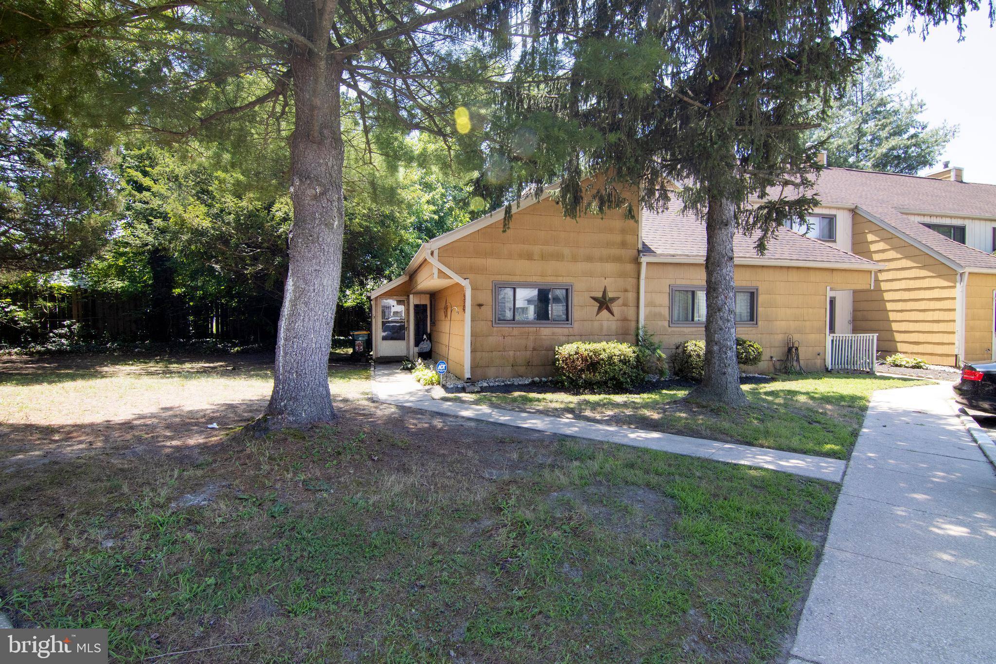 15 Dover Drive Lindenwold, NJ 08021 - Photo 2 of 24 a front view of a house with a yard and large tree