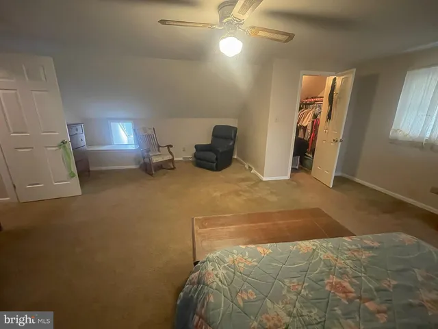 a bed room with a bed and a lamp