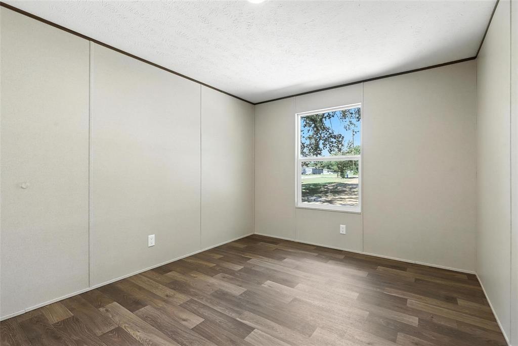 131 Kelly Court Azle, TX 76020 - Photo 16 of 22 an empty room with a window