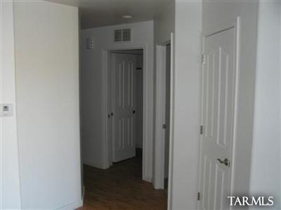 6966 South Radec Lane Tucson, AZ 85756 - Photo 5 of 8 a view of a hallway with wooden floor